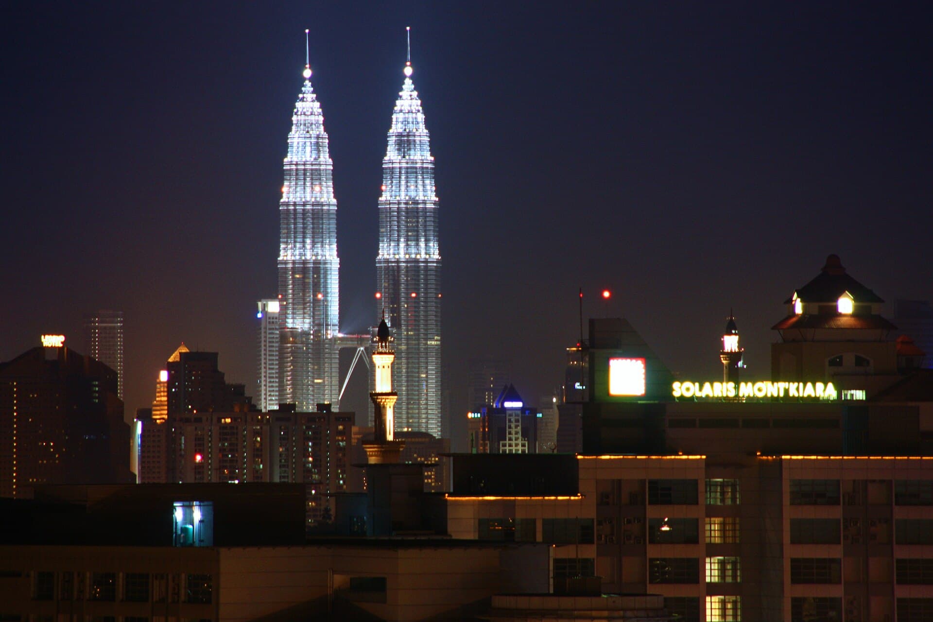 Kuala Lumpur skyline with Mont Kiara and the Petronas Towers at night